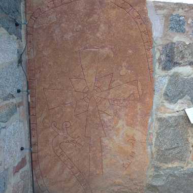 The runestone in the church wall.
