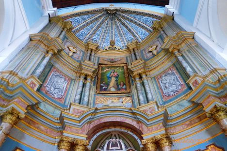 The cathedral's restored reredos, once a golden tomb for green bees. 