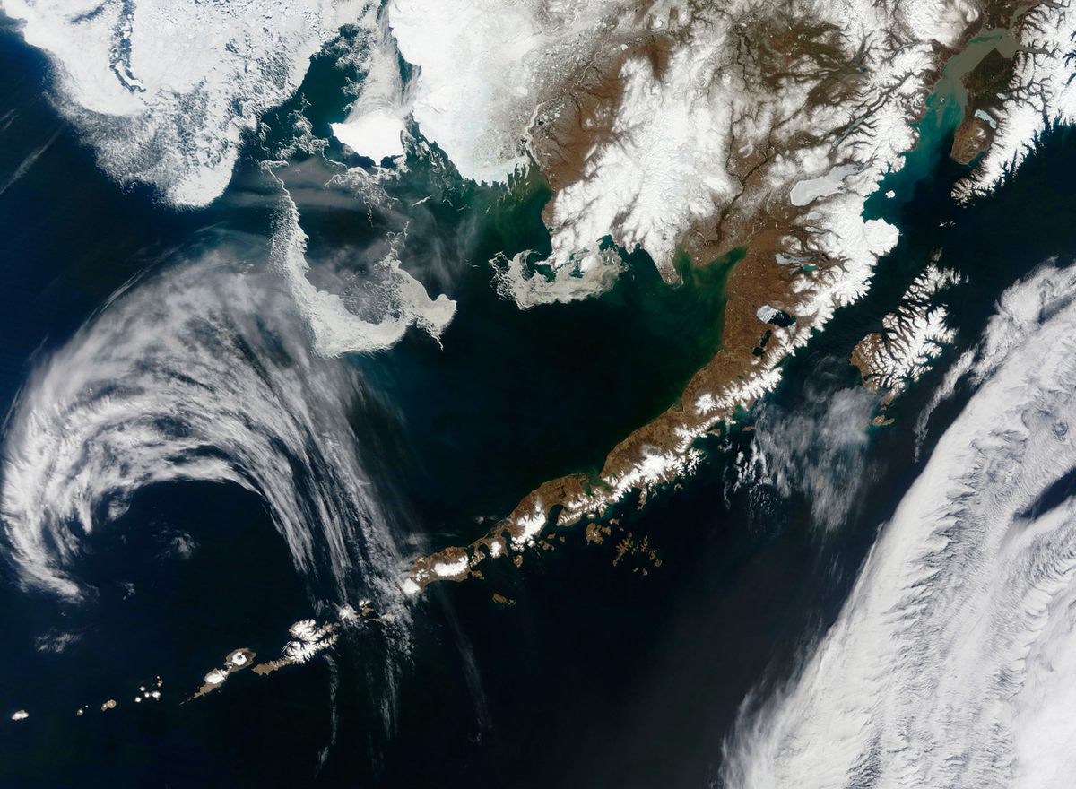 The Aleutian Islands extend from the Alaskan Peninsula all the way to the Russia's Kamchatka Peninsula.