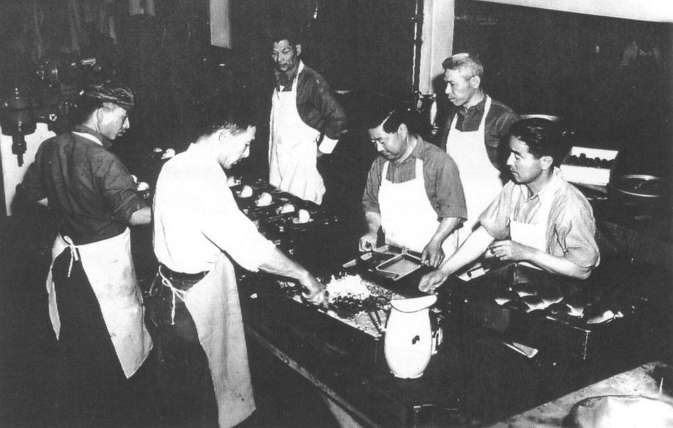 Japanese internees cook in the Fort Missoula kitchens.