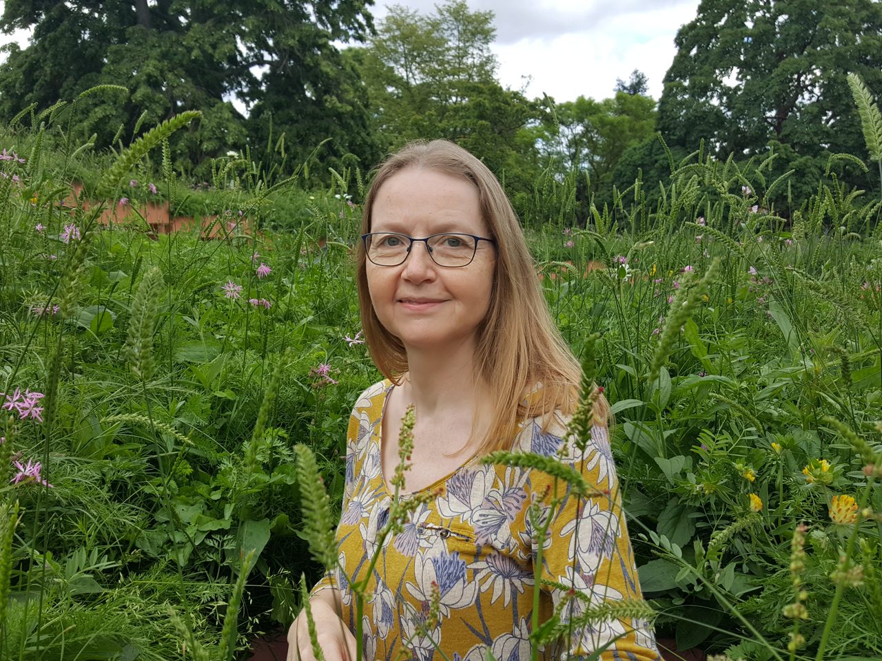 The plants around Liz Dauncey in this photo are not poisonous, but many common garden and houseplants are.