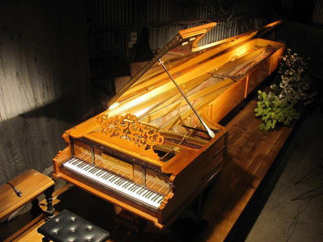 After touring New Zealand, one of the world's largest pianos returned home to the man who made it.