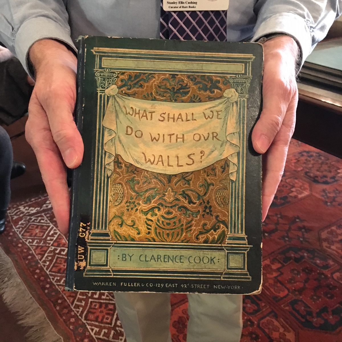 Stanley Ellis Cushing, holding a very relevant book.