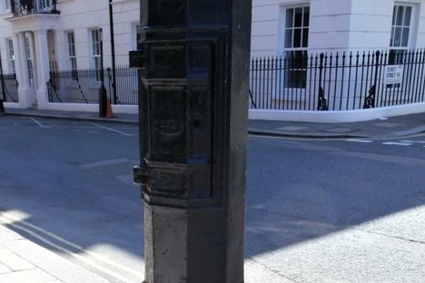 Base of the lamp post; the small door can be seen towards the top of the photo.