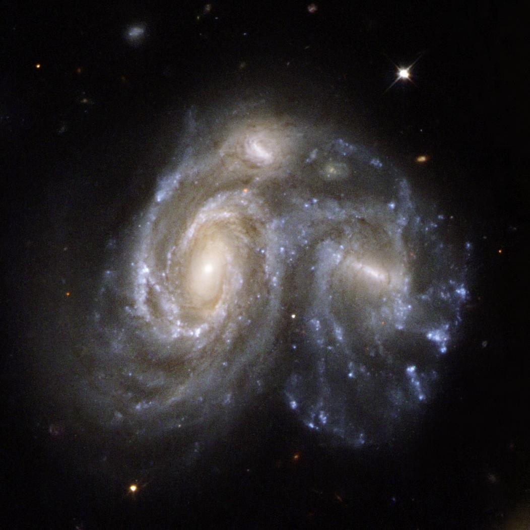 A Hubble telescope image of two spiral galaxies colliding. 