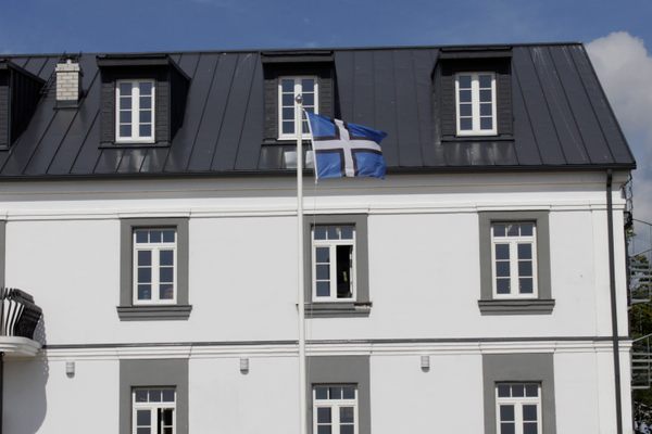 The flag of the kingdom in front of a local museum.