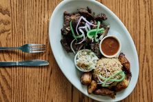 The kabrit, or twice-cooked goat, with plantains and rice and beans is essential. 
