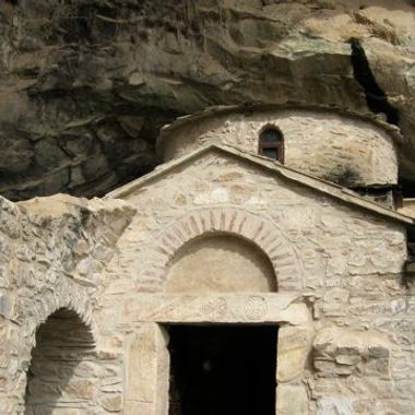 Exterior of the rare, double-church of the Byzantine age built directly into the front of the cave.