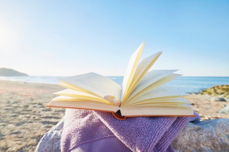 Summer essentials: water, sunscreen, and a good book.