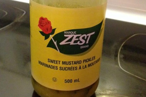 A lonely, half-eated jar of Zest Sweet Mustard Pickles.