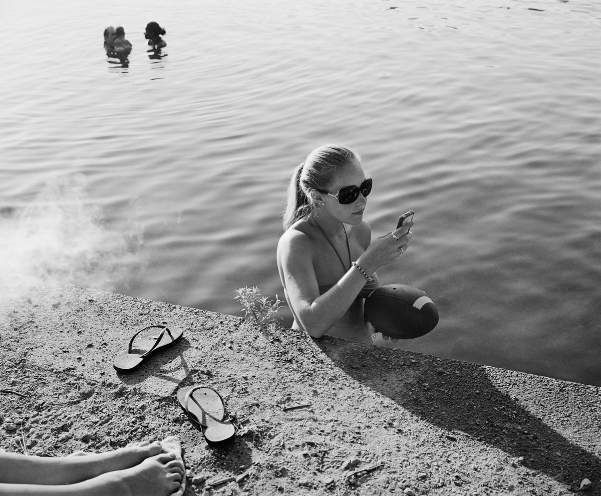 A Walden Pond swimmer, multitasking.
