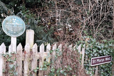 The signs showing the well entrance.