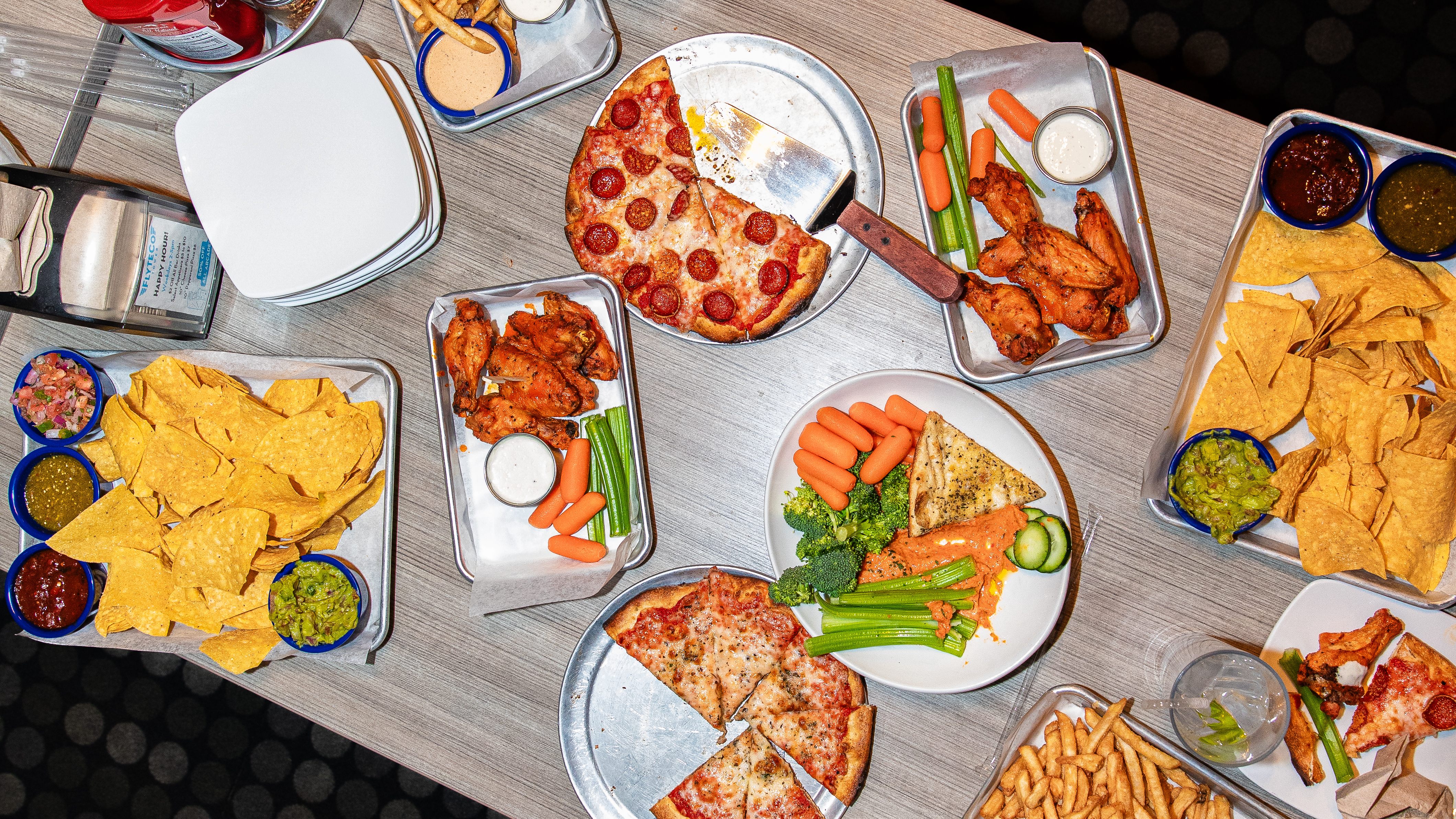 Within FlyteCo’s 142-foot tower, you’ll find hot pizza, classic buffalo wings, and other soul-warming pub food. 