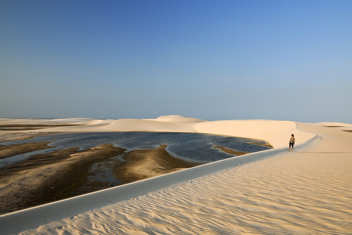 A tourist observes Rio Negro Beach Maranhao.