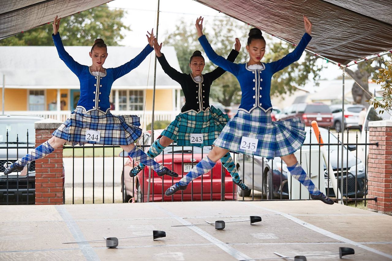 Highland Dancers get some air at the Scottish Highland Games in Salado, Texas. 

