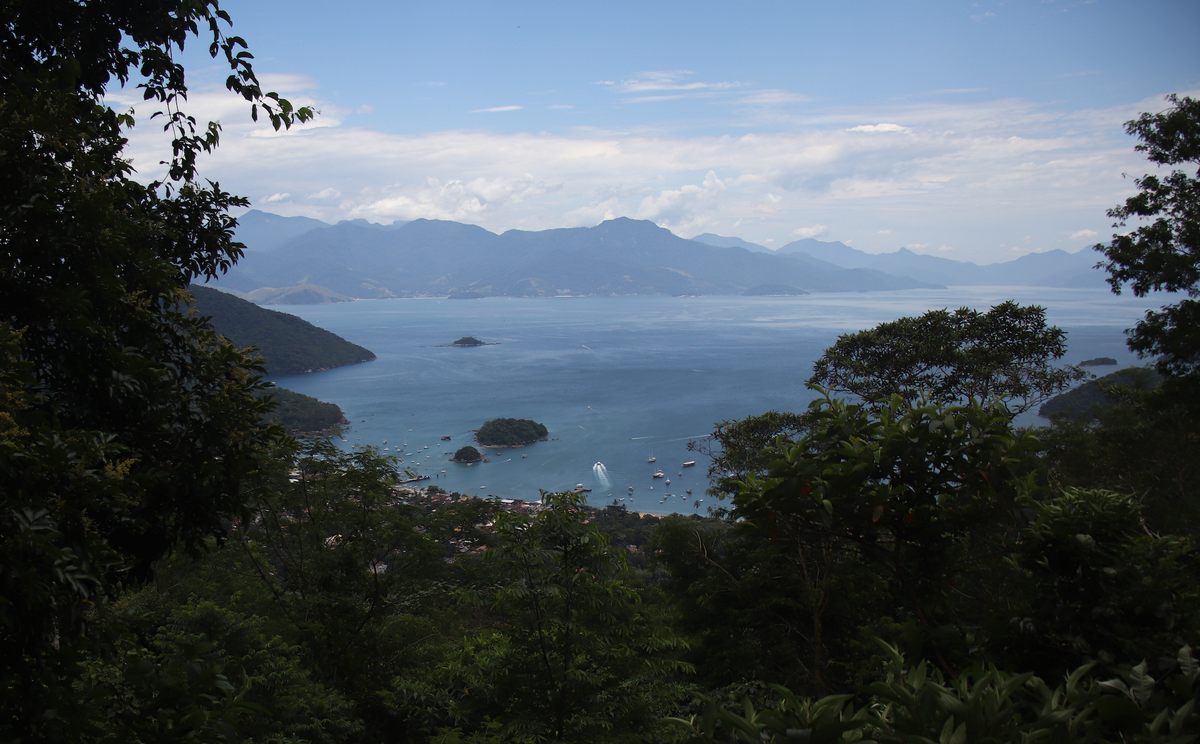 To reach Dois Rios, visitors can hike six miles on a dirt road from Abrãao (shown here), a small town popular with tourists.