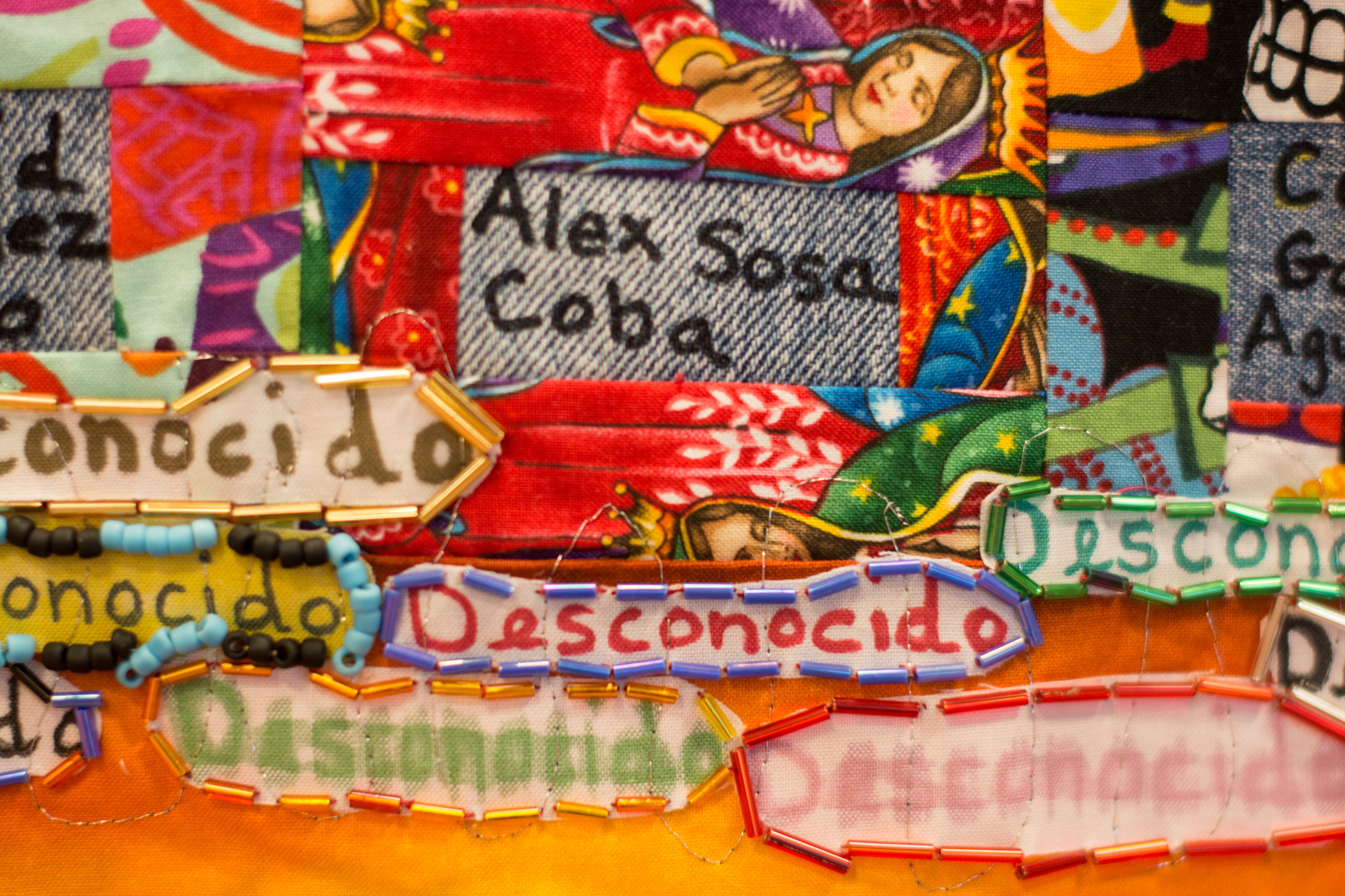 A detail from a Migrant Quilt Project quilt shows the name of a migrant who died crossing from Mexico to Arizona. Many deaths are listed as "desconocido," unknown.