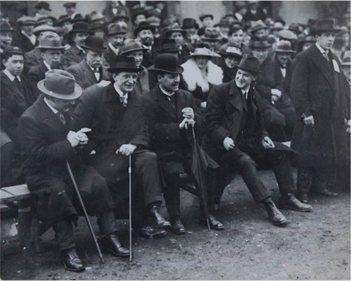 De Valera attending a 1919 gaelic football match with Prime Minister Arthur Griffith and Michael Collins in Croke Park, Dublin.