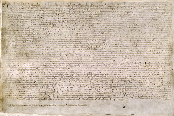 The Magna Carta of 1215, written in iron gall ink on parchment paper, in medieval Latin.