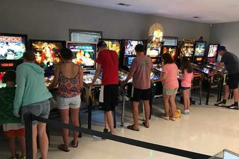 Patrons line-up to play the museum’s collection of old-school pinball machines, which started from one man’s love of the game.