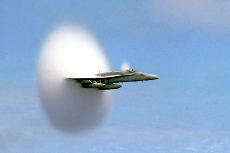 An F/A-18 Hornet over the Pacific Ocean, in July 1999.