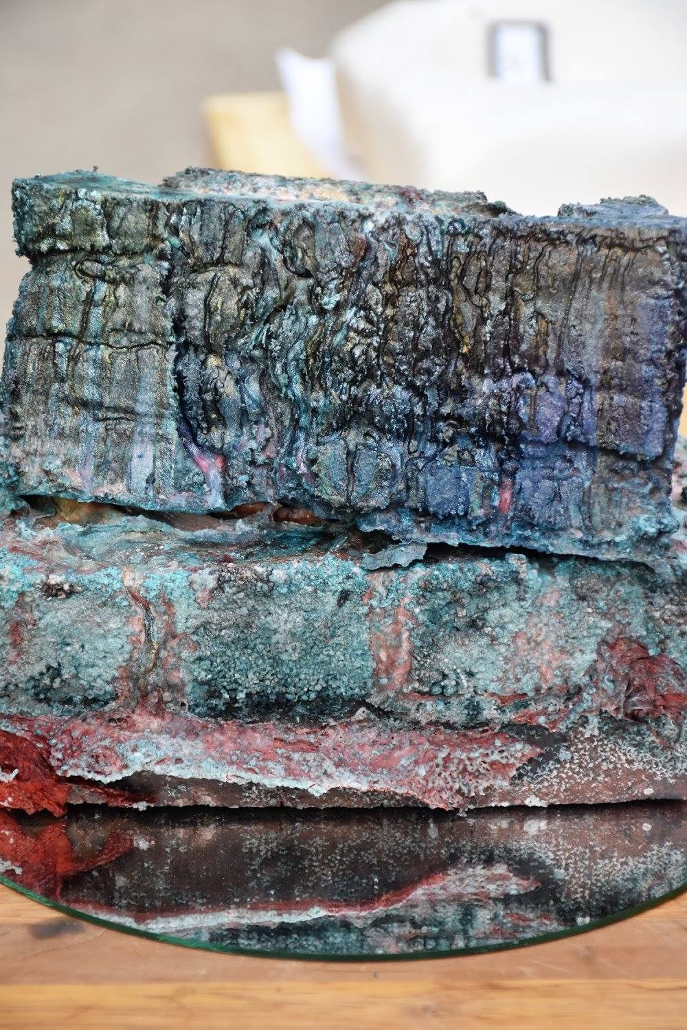 "One Drop At a Time," by Baker Head Start Preschool, won the "Forgery" category. Head Start students and their families made this piece by slowly dripping water and paint over a salt block.