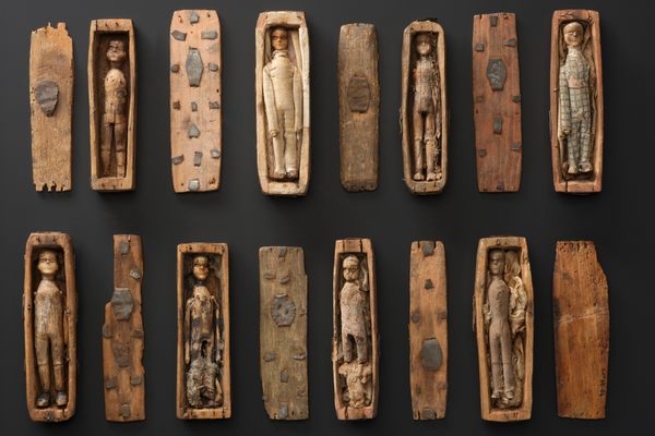 A collection of 8 coffins with their lids and carved figures, found in a rocky niche on the north-eastern slopes of Arthur's Seat, Edinburgh, in June 1836. © National Museums Scotland (used with permission)