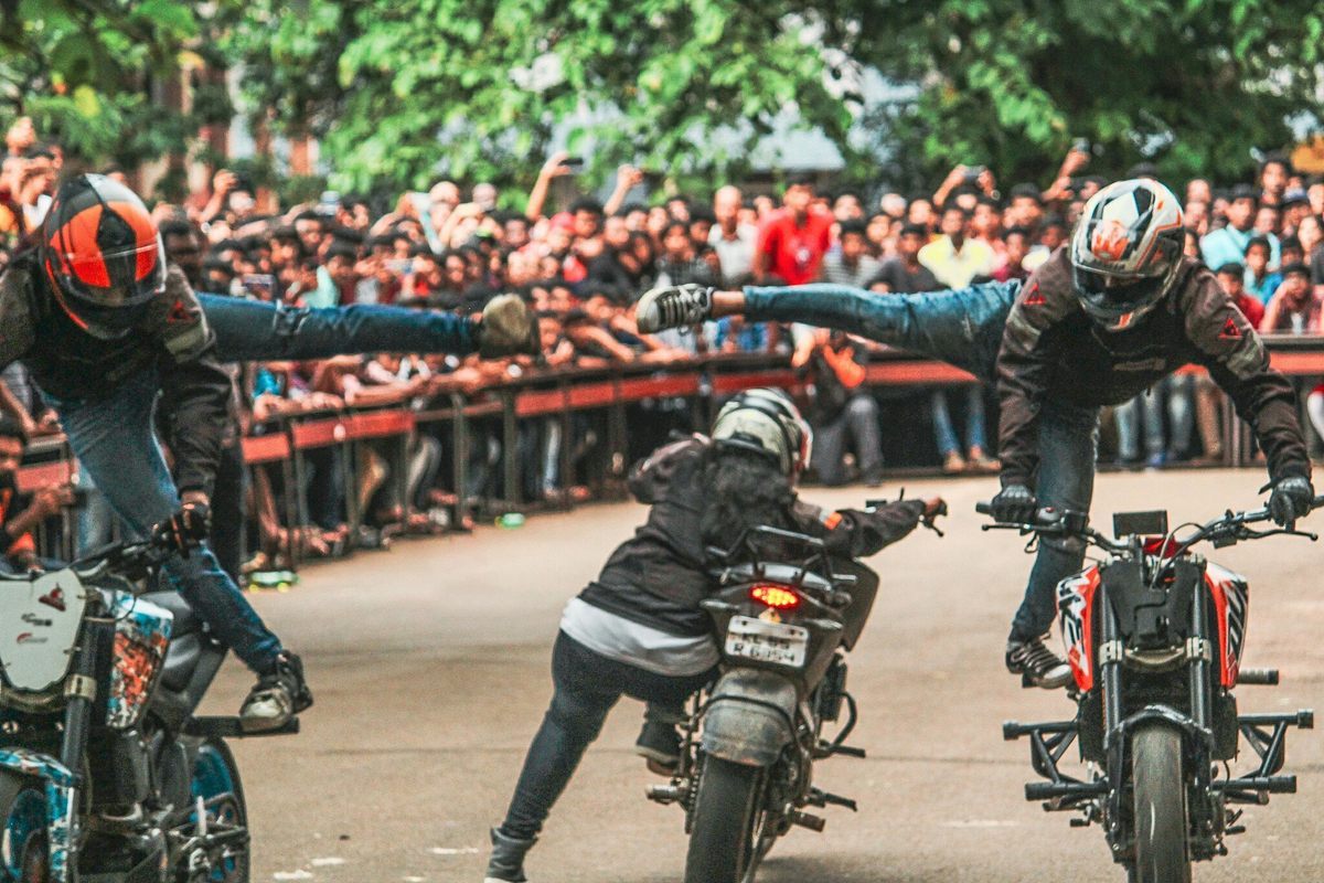 An Indian women's stunt team, Legendary Stunts Inc, perform for a cheering crowd.