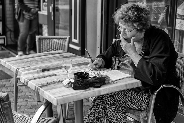 A different lady filling out a different crossword.