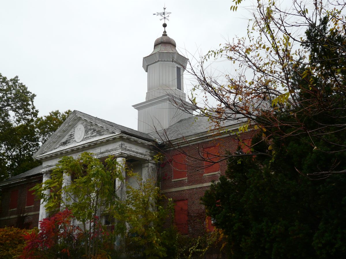 The Metropolitan State Hospital's administration building, pictured in October 2019. Many of the facility's buildings were torn down or redeveloped into apartments in the 1990s.*