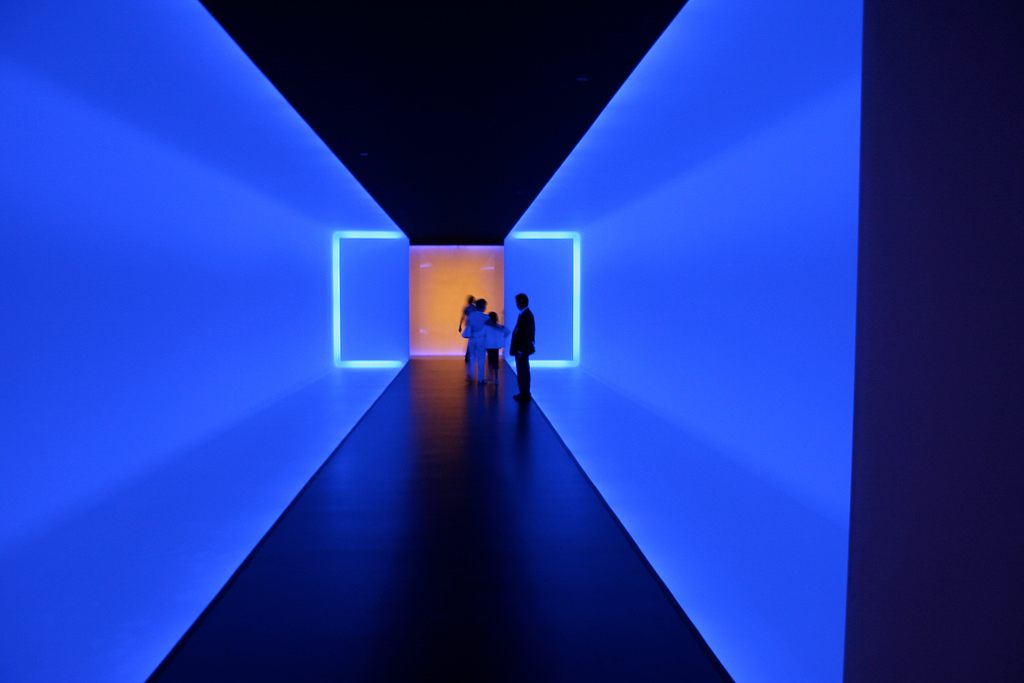 A guard is illuminated by James Turrell's "The Light Inside" at the Museum of Fine Arts, Houston.