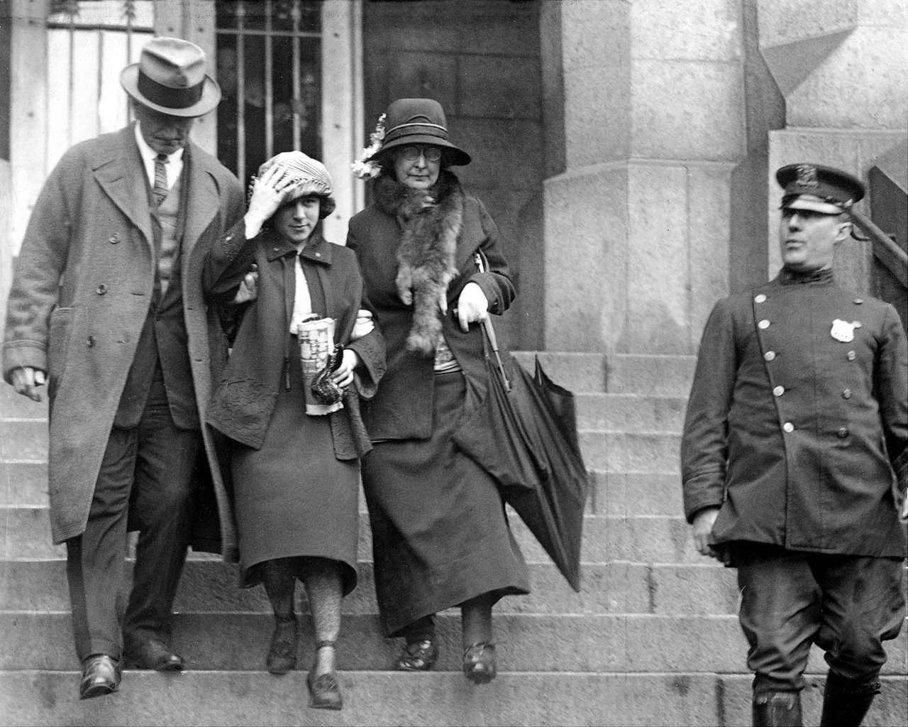 Celia Cooney, the infamous Bobbed Haired Bandit, was a symbolic figure of female empowerment in the 1920s. Here, she is seen leaving the courthouse.