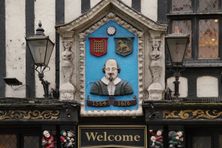 The Bard is represented on the sign. 