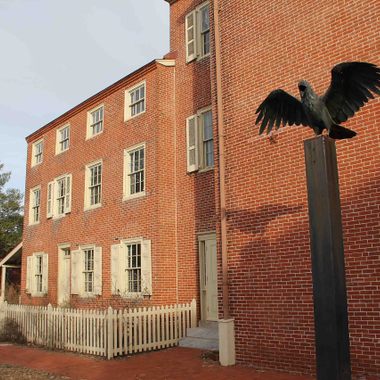 A raven statue outside the Edgar Allan Poe National Historic Site.