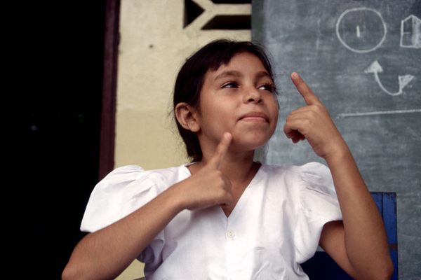 A deaf girl using Nicaraguan Sign Language at the Esquelitas de Bluefields, Managua, Nicaragua, 1999. 