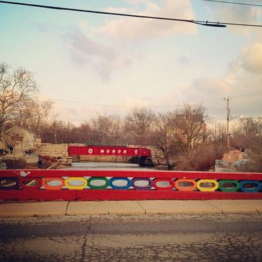 Seen here against the backdrop of the Monon Trail bridge, Rainbow Bridge is the main method of transit for cars crossing White River via Broad Ripple Village