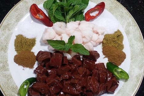 Cubes of liver with tail fat, mint, and spices.
