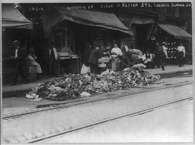 Piles of garbage at Essex and Hester Streets, Lower East Side, during garbage collectors' strike 