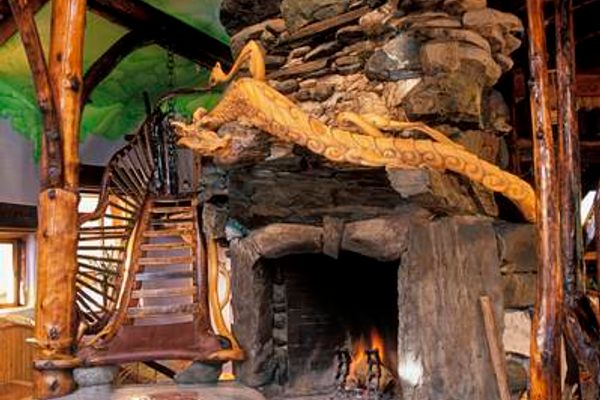 The stonework fireplace and sculpted staircase that is heated by warm water flowing through the handrails.