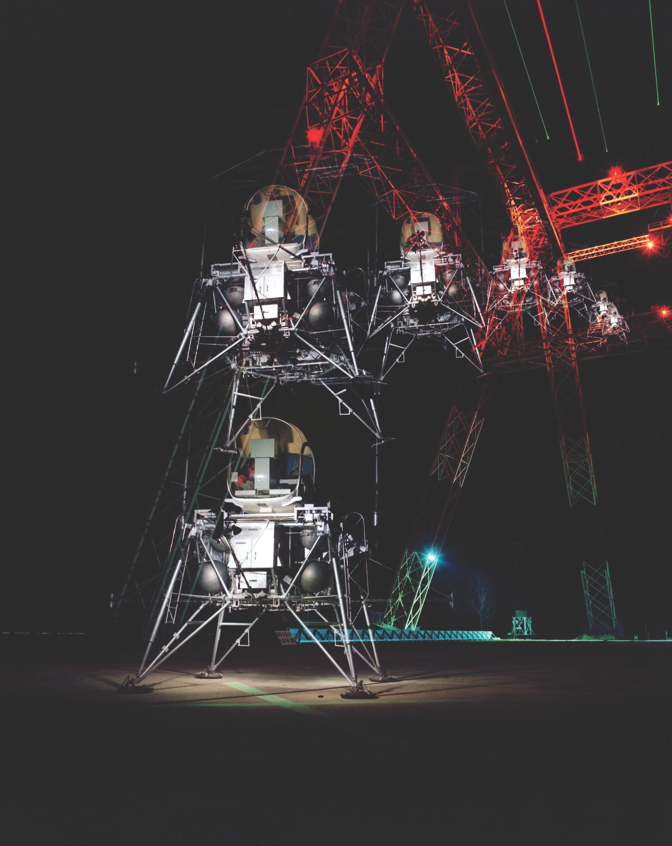 A multiple-exposure image showing a simulated Moon landing of the Lunar Excursion Module at Langley's Lunar Landing Research Facility. 