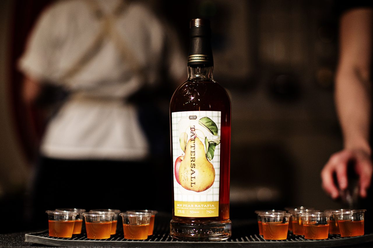 A bartender serves pear ratafia, inspired by an early-modern European recipe, at Tattersall's 2019 event. 