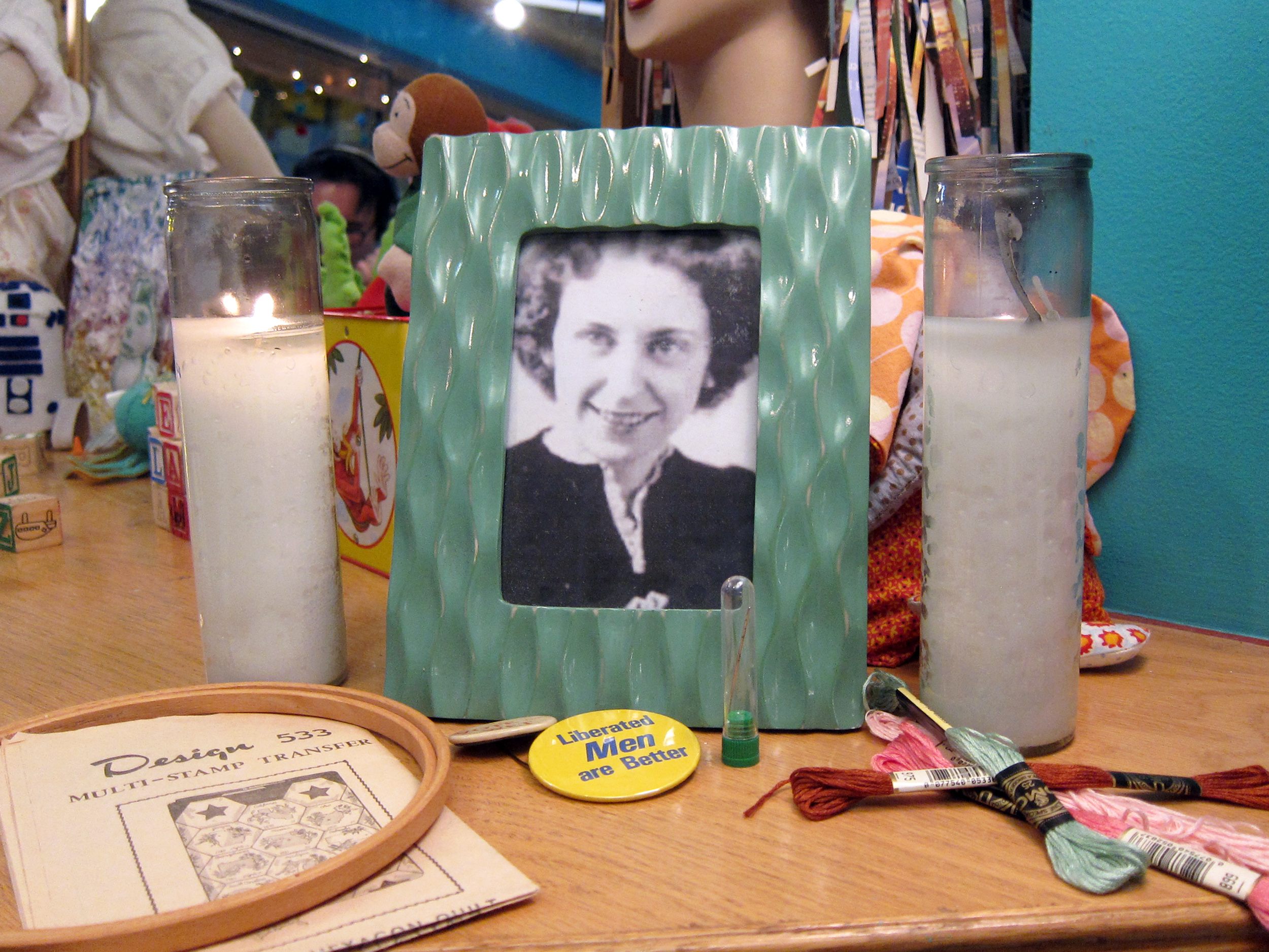 A shrine to Rita Smith featuring her hoop, thread, and political pins, all of which Downey bought from the estate sale.