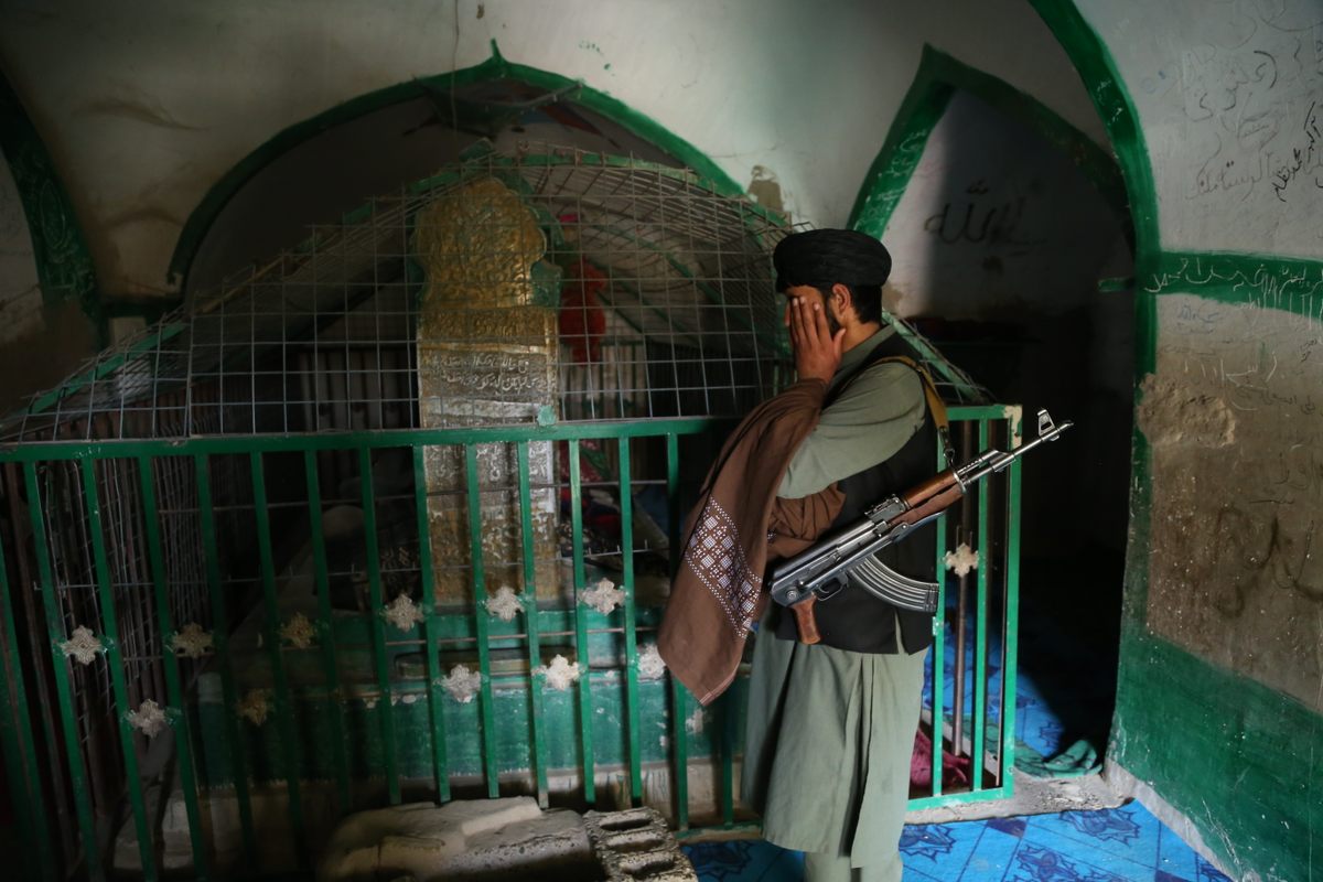A Taliban soldier guards the Amir Hamza shrine, which is associated with a variety of supernatural stories.