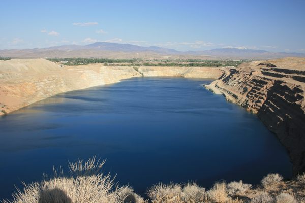 Yerington pit lake, May 2015.  The road on the pit wall to the right indicates the relative depth.