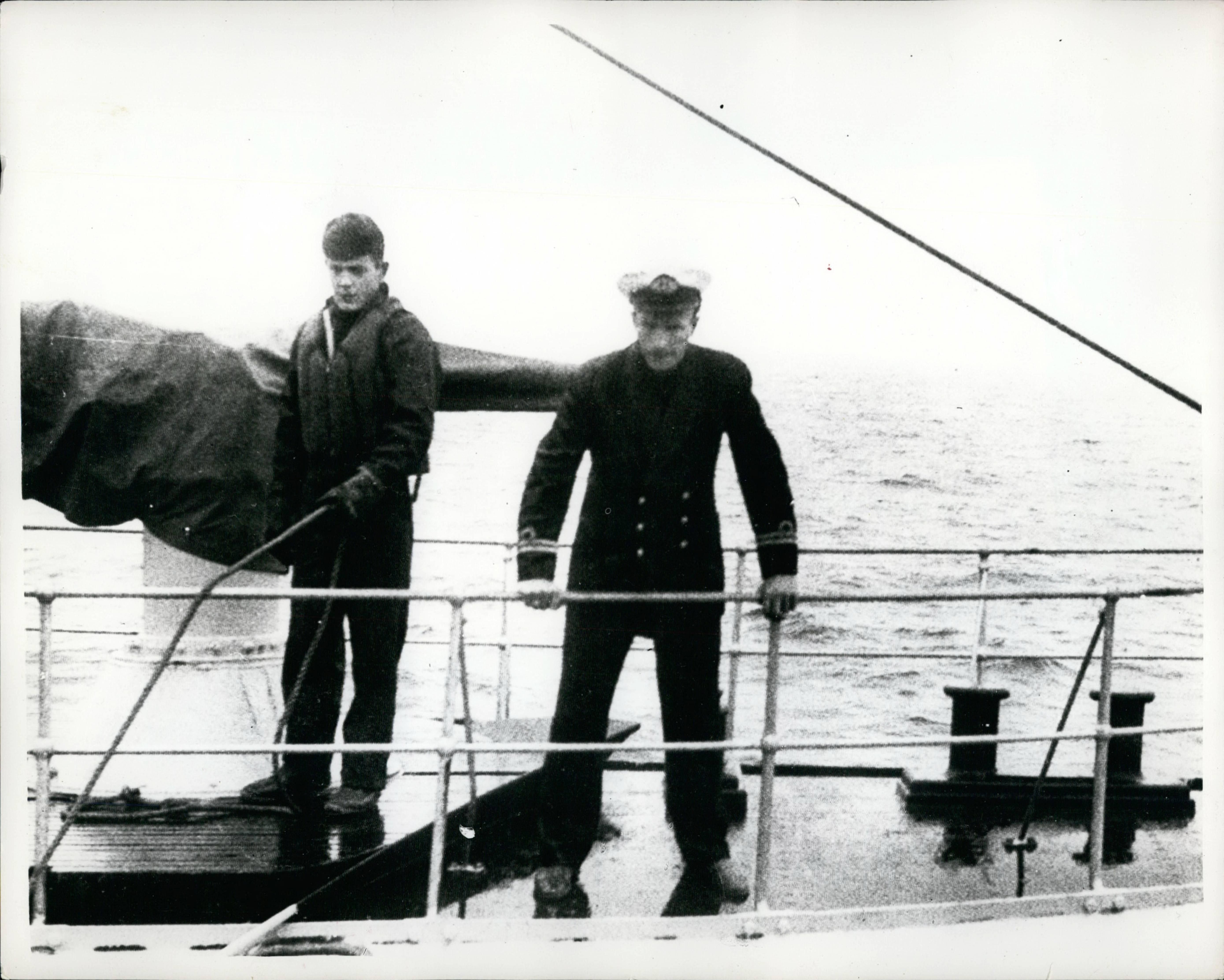 A British naval officer in 1958 keeps a watch on British fishing vessels.