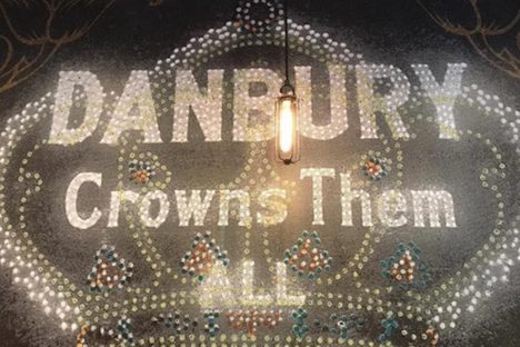 "Danbury Crowns Them All" dominates the cafe's wall.