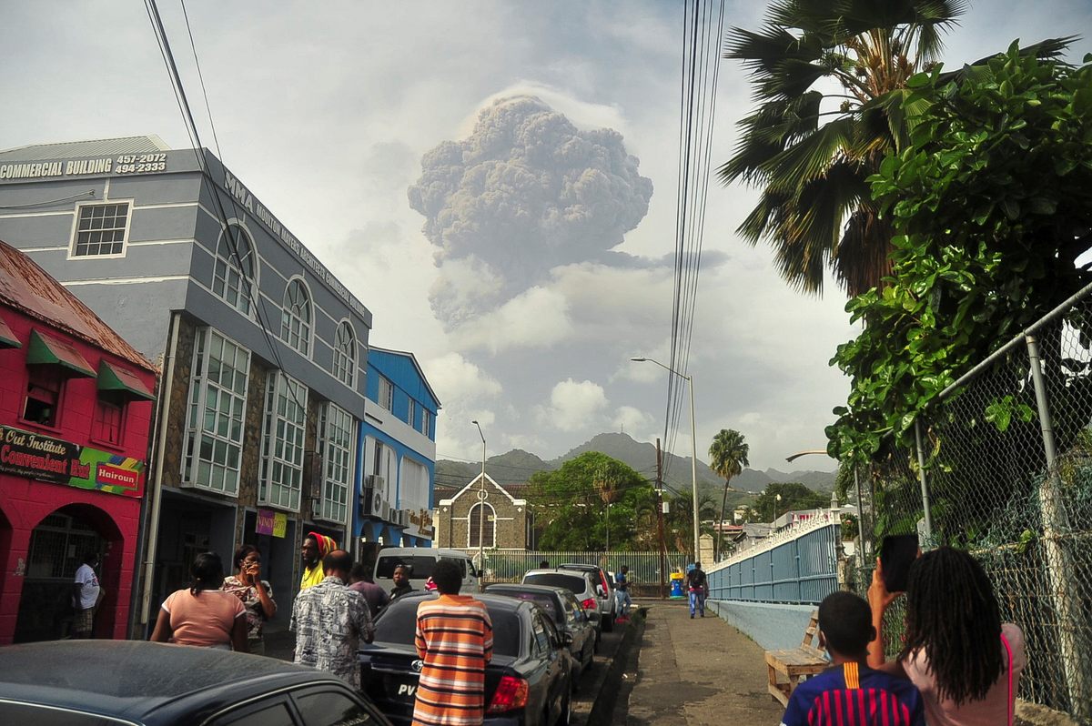 Ash and smoke billow from the eruption.
