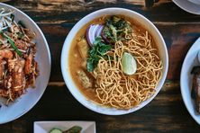 Khao soi, the popular northern Thai noodle dish, comes with a richly spiced coconut broth here.