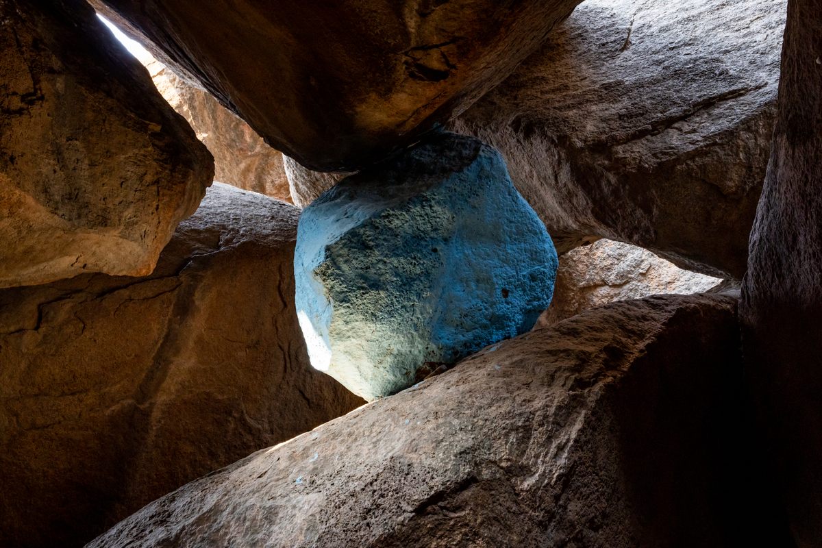 A smaller boulder within one of the many caves created in the rock formations of Hyderabad's Khajaguda area.