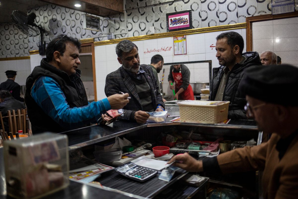 Customers pay at the counter for lunch at Dilbar.